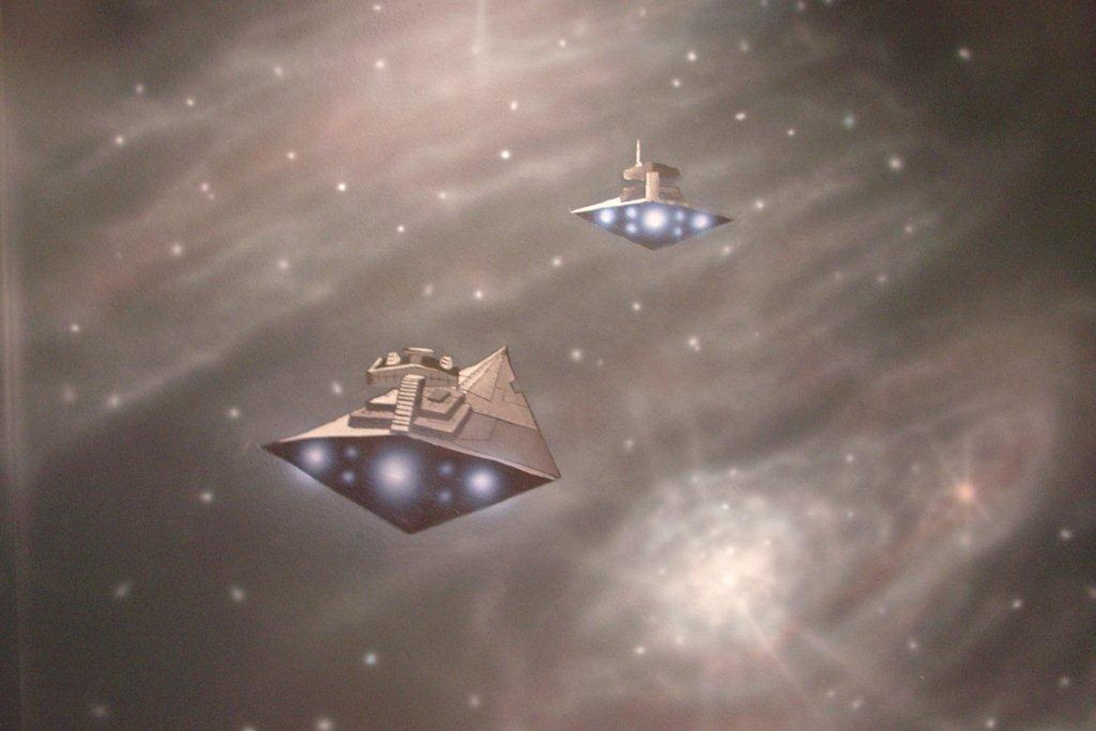 Hand-painted space mural ceiling in children's bedroom featuring Star Wars Star Destroyers against nebula star field
