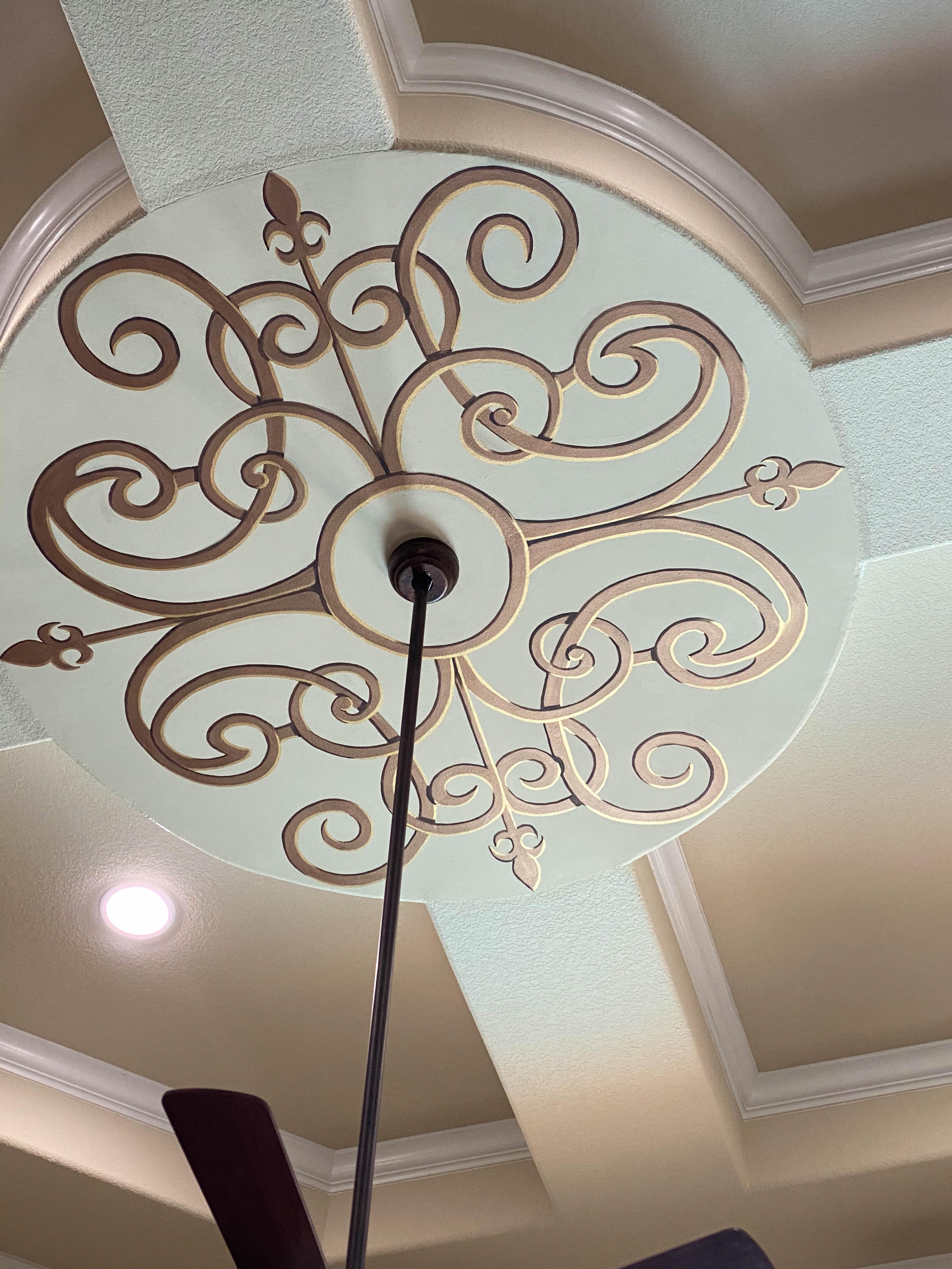 Modello stencil ceiling medallion with gold bronze scrollwork and fleur-de-lis on sage circular inset, Houston decorative finish