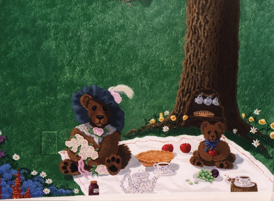 Hand-painted children's room mural with teddy bear picnic scene, storybook style, featuring florals and teacups on green garden background.