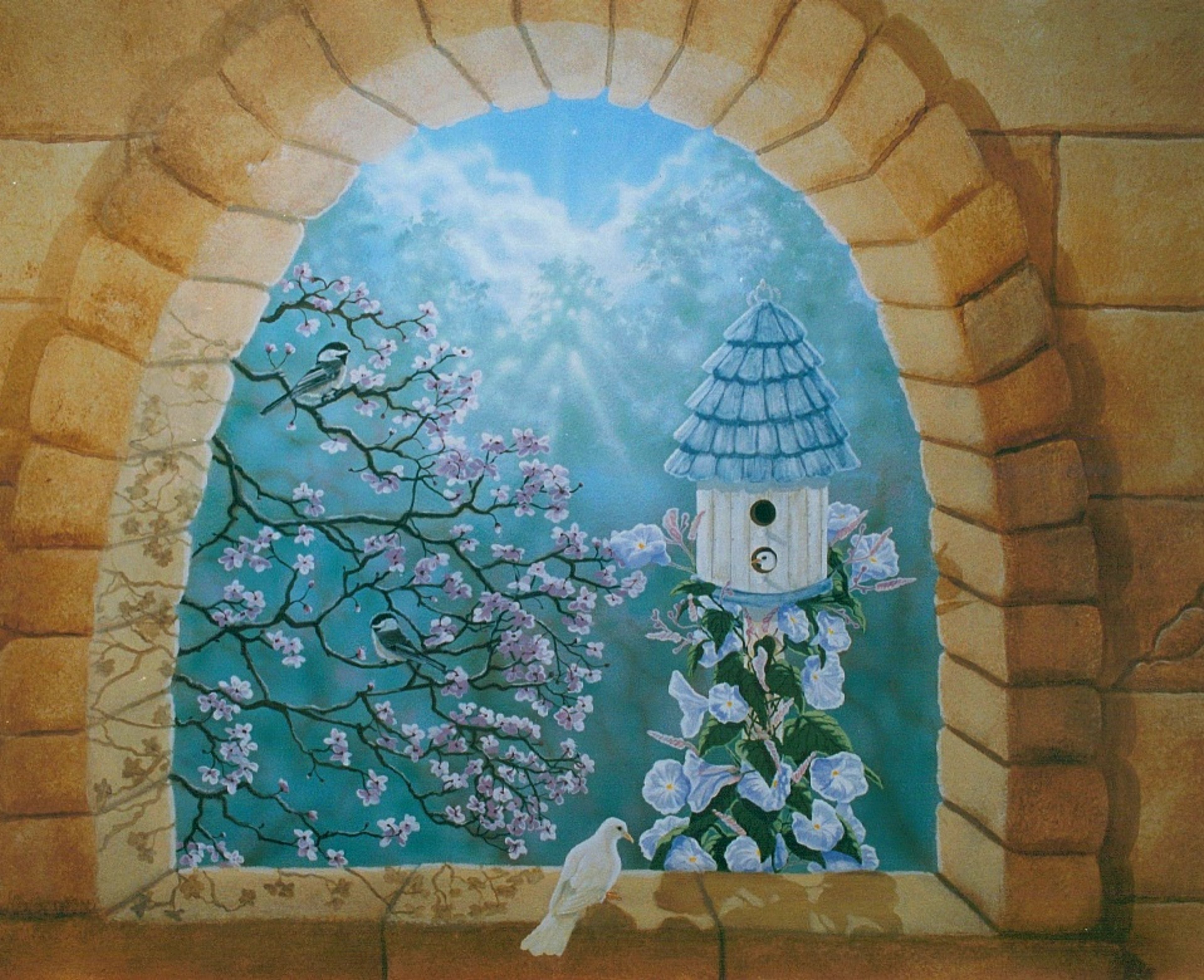 Trompe l'oeil hand-painted mural of stone arch with garden vista, cherry blossoms, birdhouse, and white dove