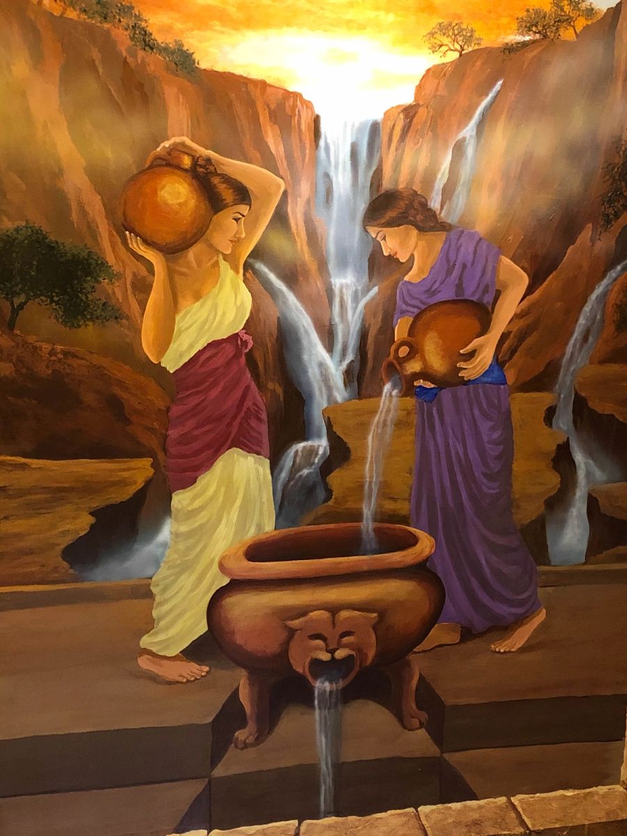 Trompe l'oeil figurative mural with classical women pouring water into lion-footed cauldron against painted waterfall backdrop.