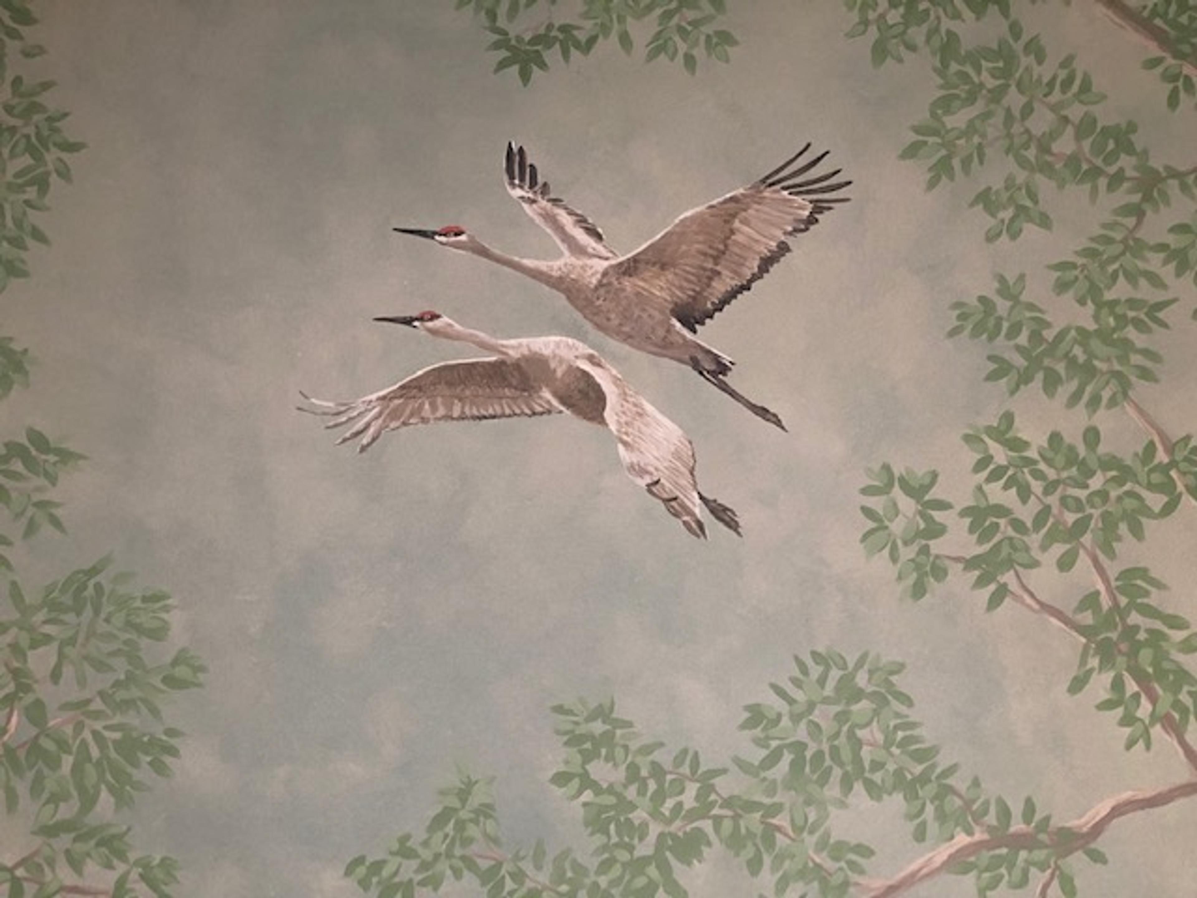Hand-painted sandhill crane wall mural with botanical framing, soft blue sky background, residential interior, naturalistic style.