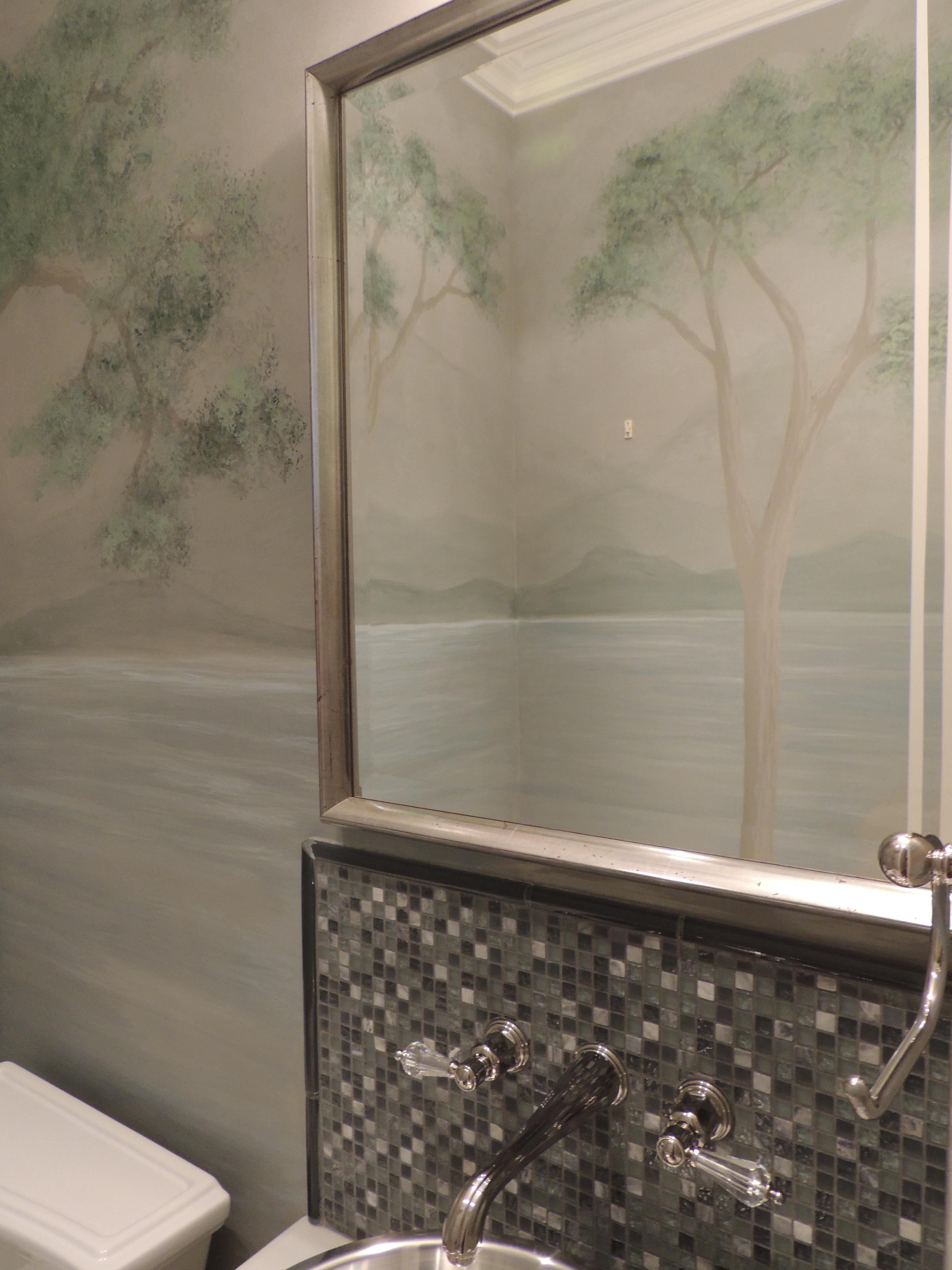 Hand-painted botanical tree mural in sage and taupe tones adorning bathroom walls alongside grey glass mosaic tile and polish
