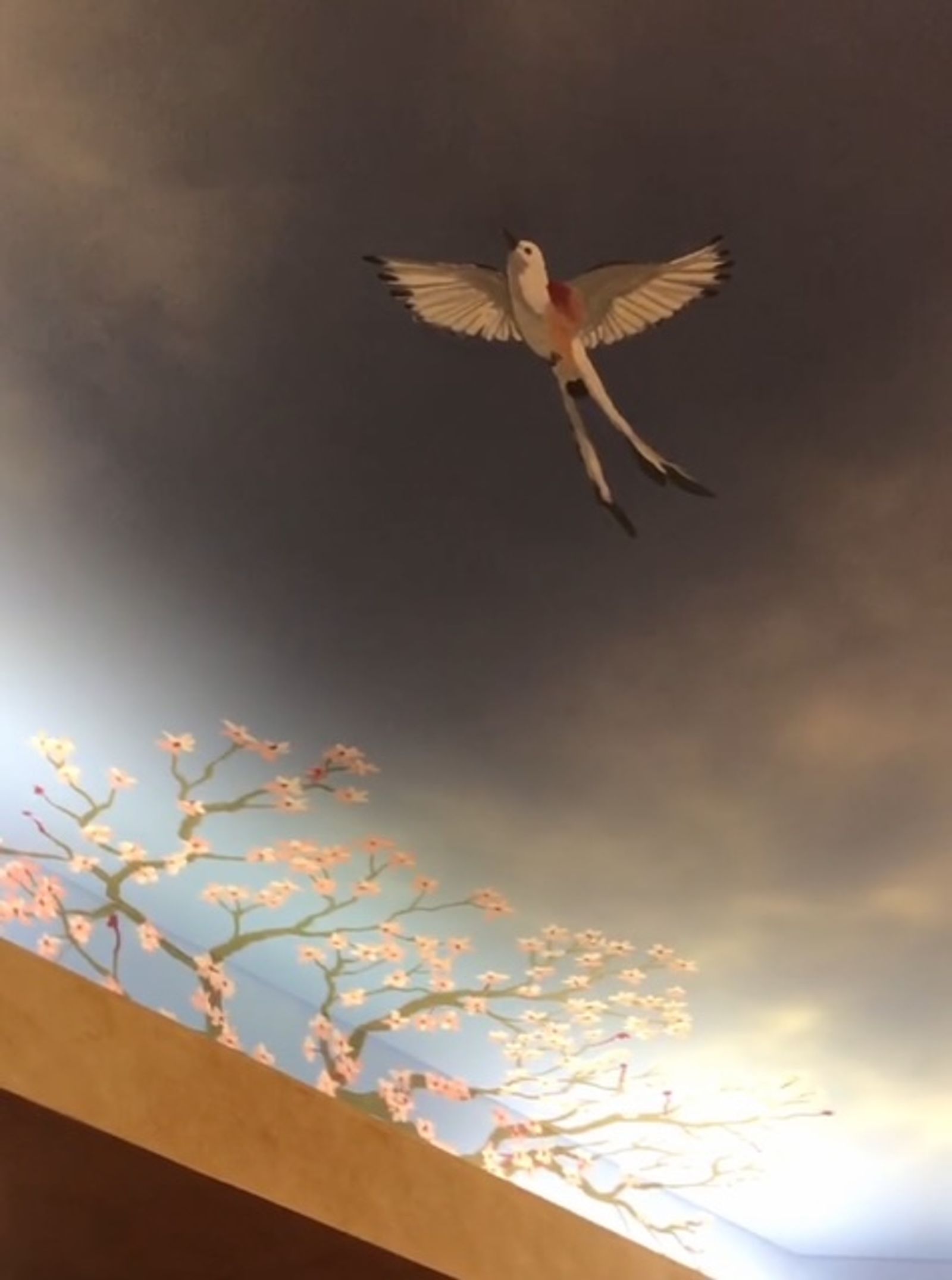 Airbrushed ceiling mural with scissor-tailed flycatcher, cherry blossoms, and stormy sky gradient in residential space