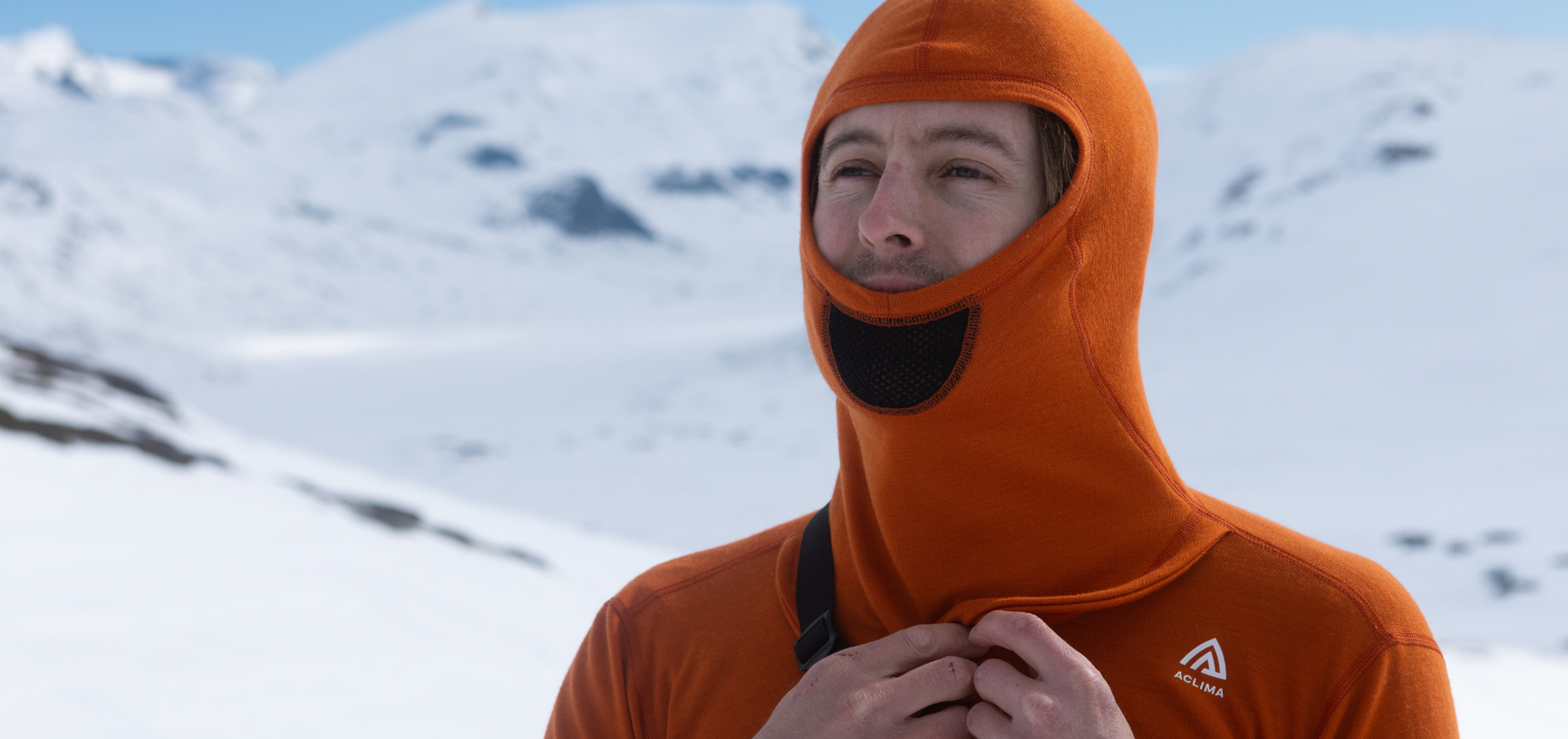Aclima WarmWool men's orange sweater in 100% merino wool