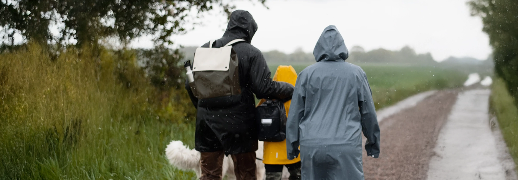 three people on a road 