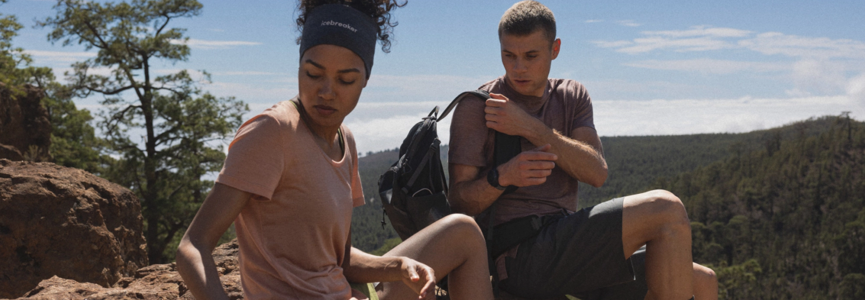 2 people on a hill 