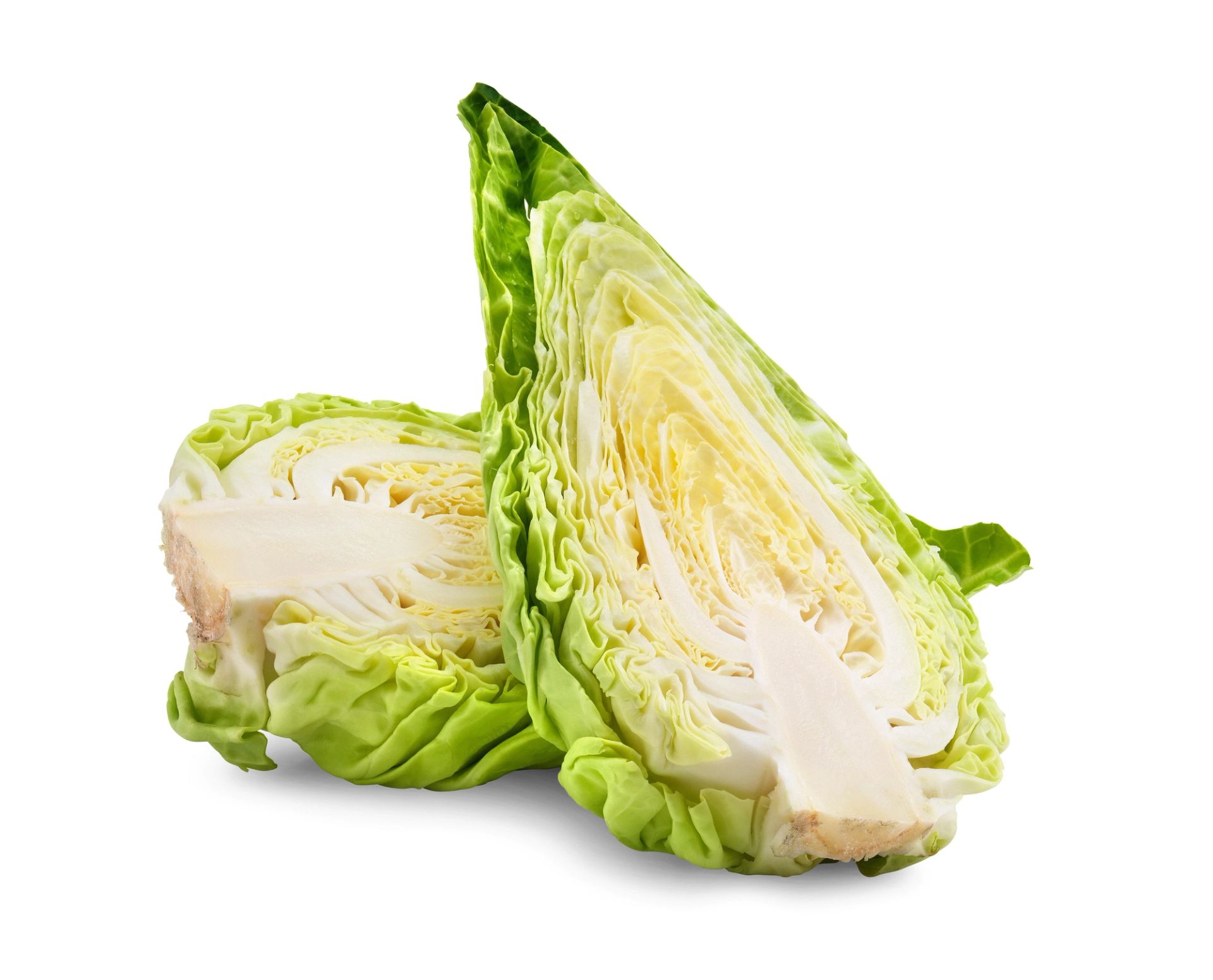 En delt grønn og hvit spisskål med snittflaten fram. En delt spisskål ligger i bakgrunnen. 