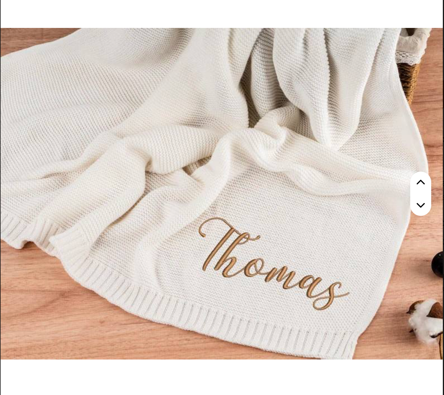 Cream cable-knit baby blanket with a teddy bear