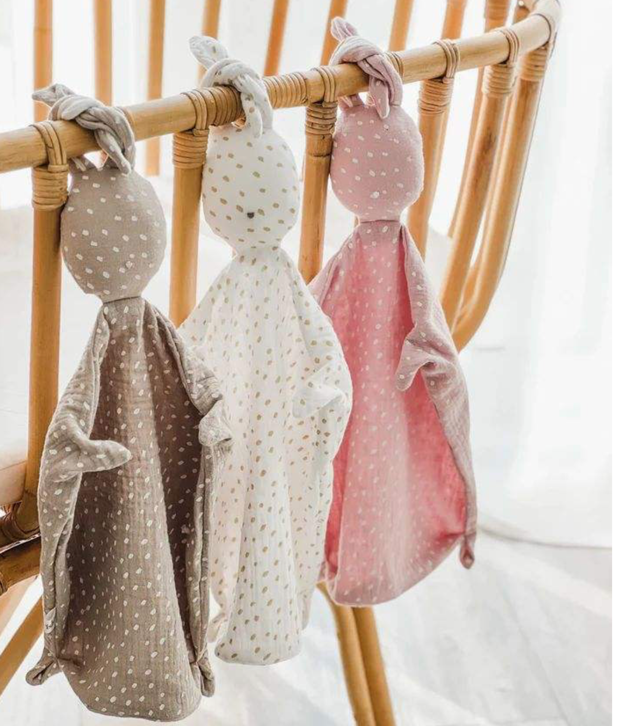 Plush teddy bear and lamb lovey in a basket