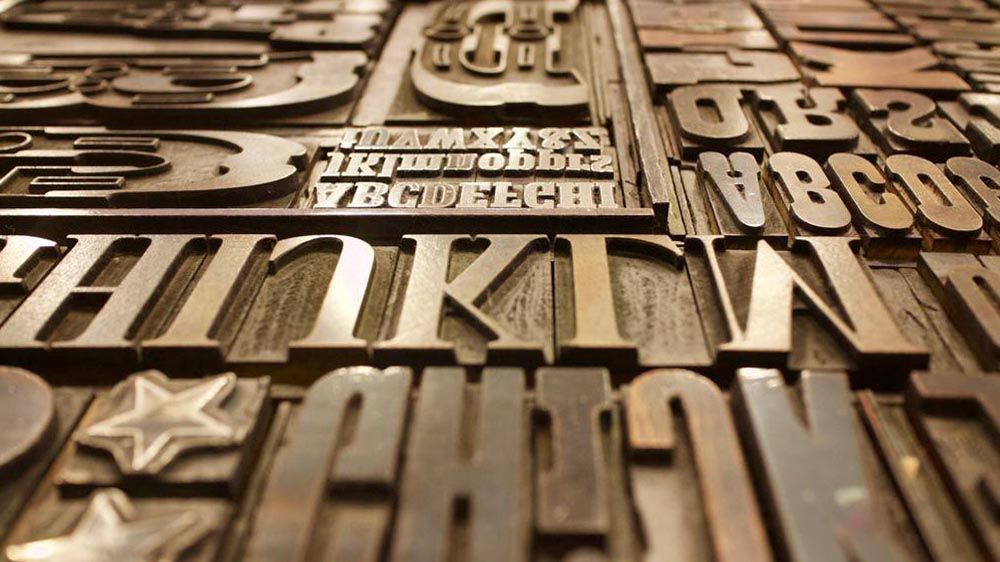 A photo of letters from a letterpress
