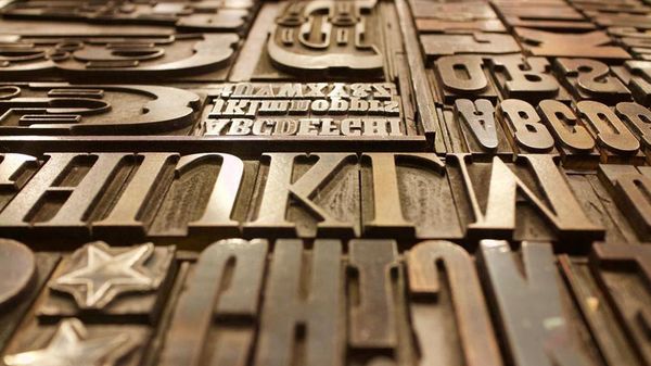 A photo of letters from a letterpress