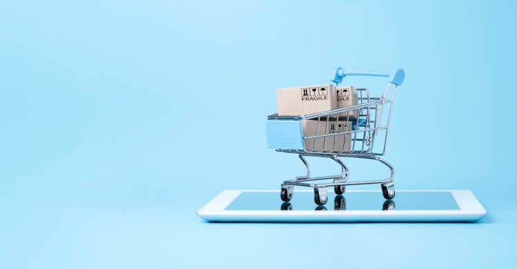 Shipping boxes in a blue shopping cart symbolizing retail digital commerce trends - Global Banking & Finance Review