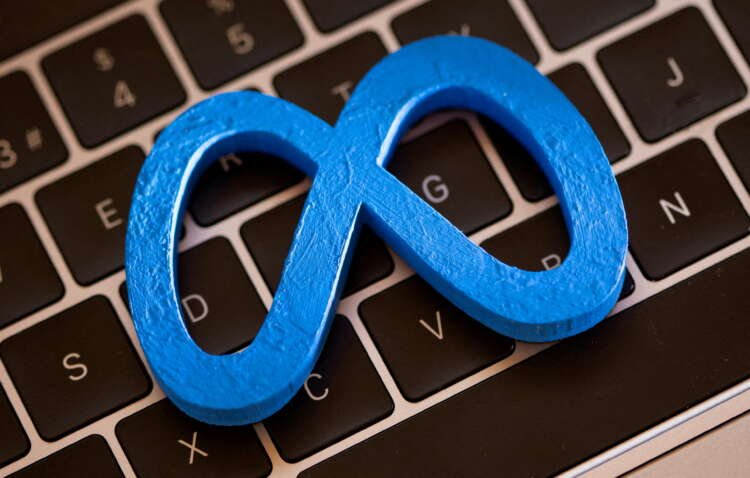 3D printed Meta logo on laptop keyboard symbolizes metaverse advertising opportunities - Global Banking & Finance Review