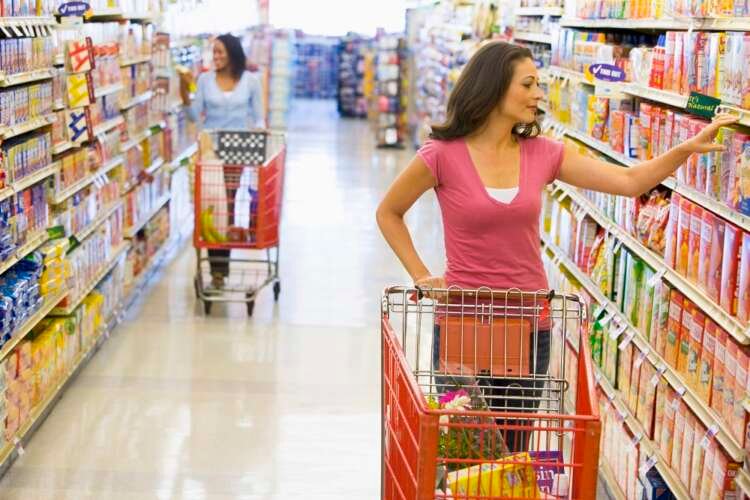 Women grocery shopping with QR codes for contactless payments - Global Banking & Finance Review