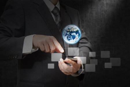 Person using a mobile phone, symbolizing global SIM shipments in 2015 - Global Banking & Finance Review