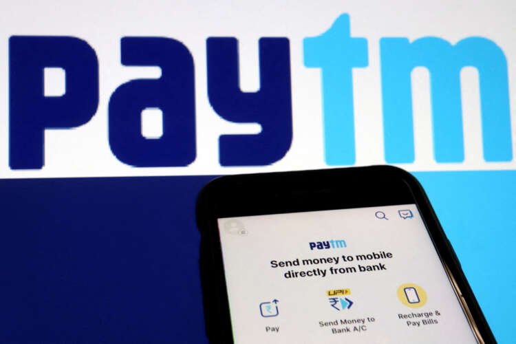 Paytm app interface shown alongside its logo, related to SoftBank and Ant Group's stake sale - Global Banking & Finance Review