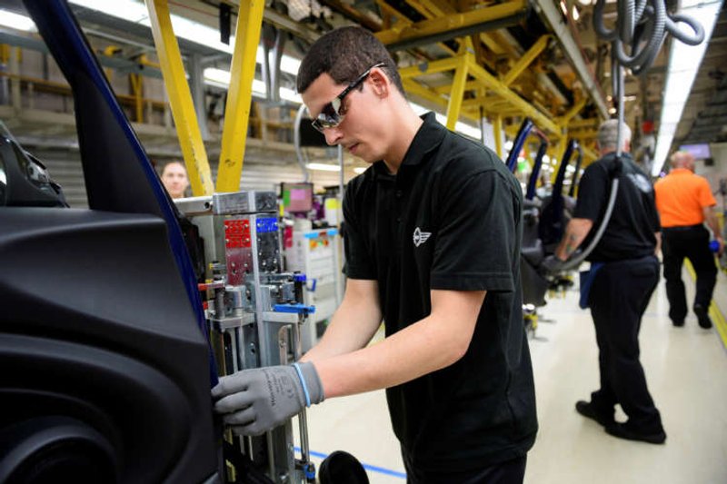 Image for UK factory output grows at slowest since May, consumer lending slides