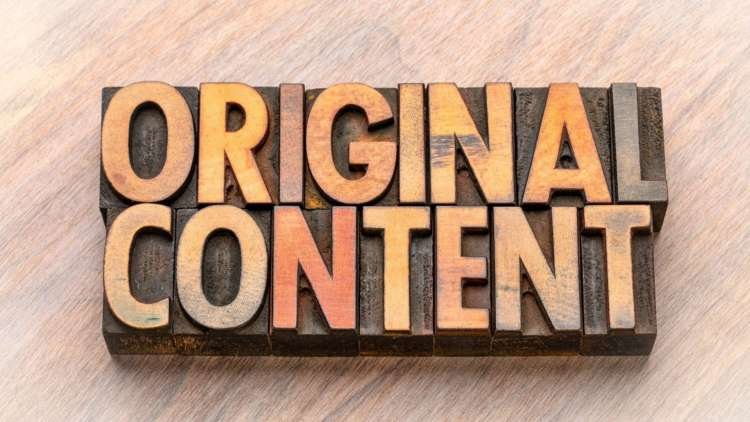 A person writing on a laptop, symbolizing original content creation for blogs - Global Banking & Finance Review