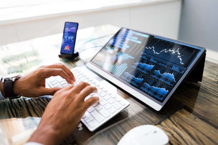 Financial analytics on mobile phone showcasing tech trends for digital transformation - Global Banking & Finance Review