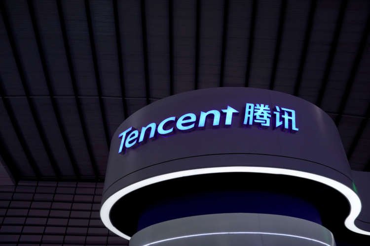 Tencent logo with gaming elements illustrating merger discussions - Global Banking & Finance Review