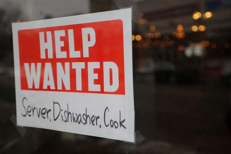 Help Wanted sign in restaurant window highlighting U.S. job growth - Global Banking & Finance Review