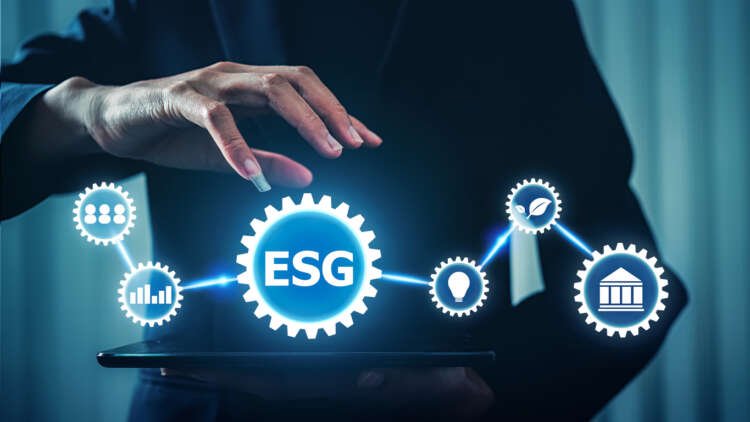 Businesswoman analyzing ESG investment data on tablet for sustainable finance - Global Banking & Finance Review