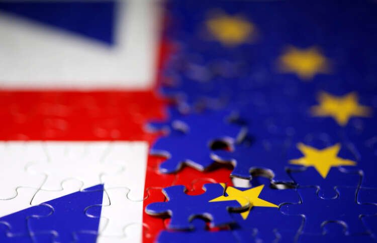 Puzzle with EU and UK flags representing Brexit challenges in online regulations - Global Banking & Finance Review