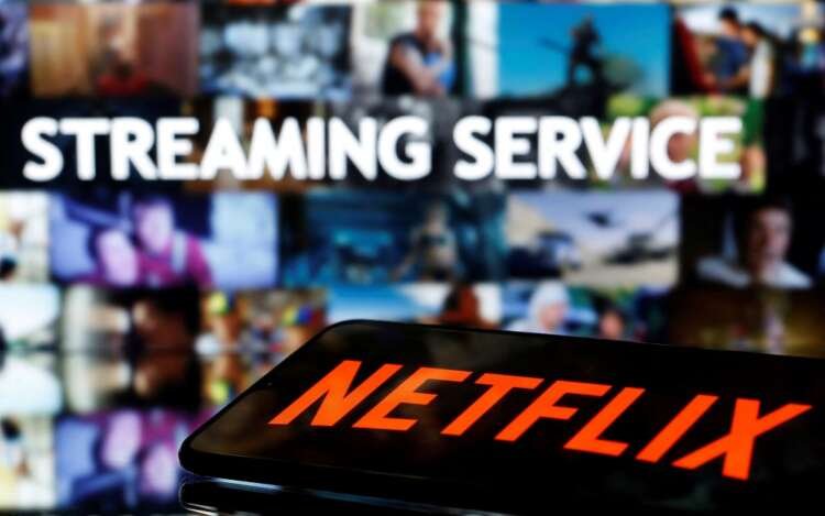 Smartphone displaying Netflix logo with streaming service text - Global Banking & Finance Review