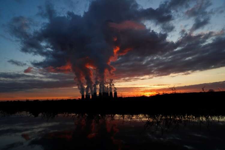 Sunset over Drax power station highlighting renewable energy amid rising electricity prices - Global Banking & Finance Review