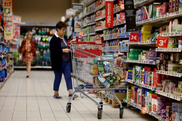 Customers shopping in a Paris supermarket, highlighting the impact of rising prices on consumer choices - Global Banking & Finance Review