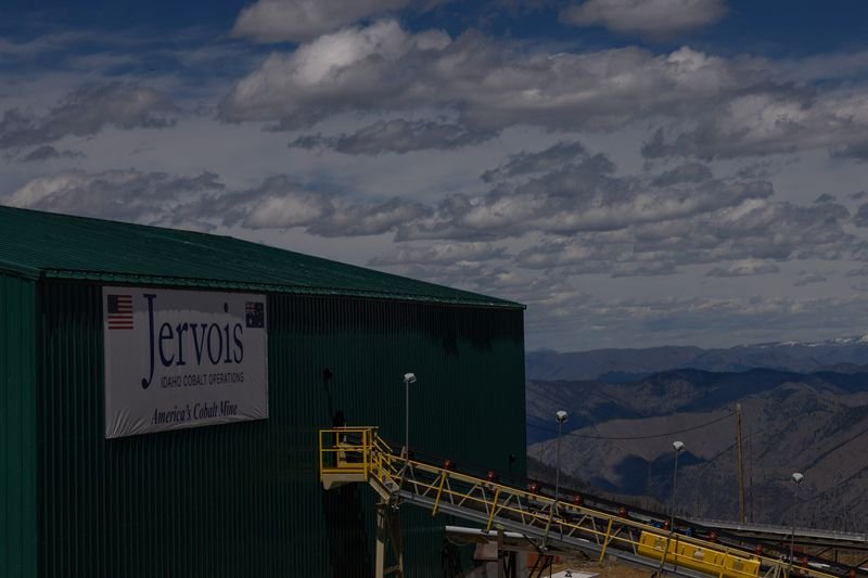 Cobalt miner Jervois's logo with a backdrop of mining equipment - Global Banking & Finance Review