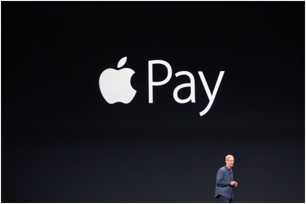 Apple Pay logo on a smartphone representing mobile payments success - Global Banking & Finance Review