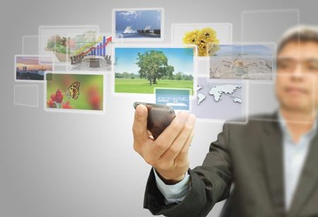 Person using a touch screen mobile phone for online banking - Global Banking & Finance Review