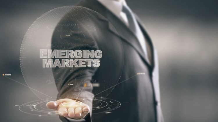 Business professionals discussing technology in emerging markets - Global Banking & Finance Review
