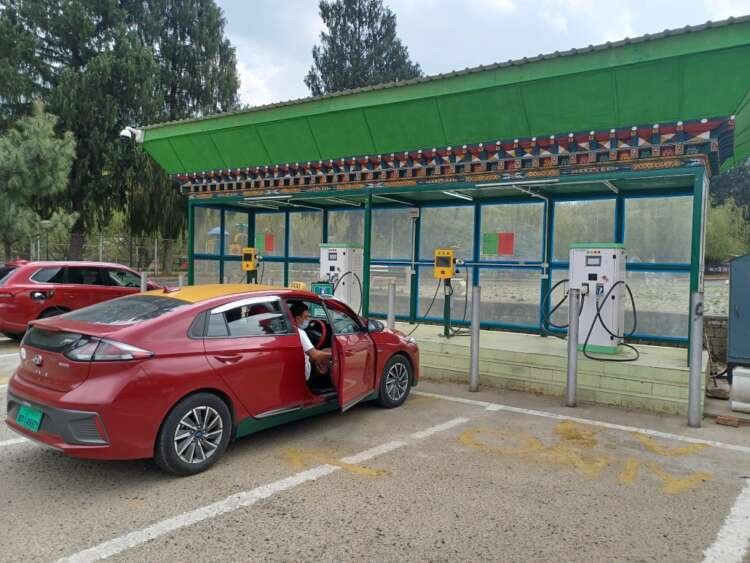 Electric taxi charging at a station in Thimphu, Bhutan, highlighting the shift to EVs - Global Banking & Finance Review