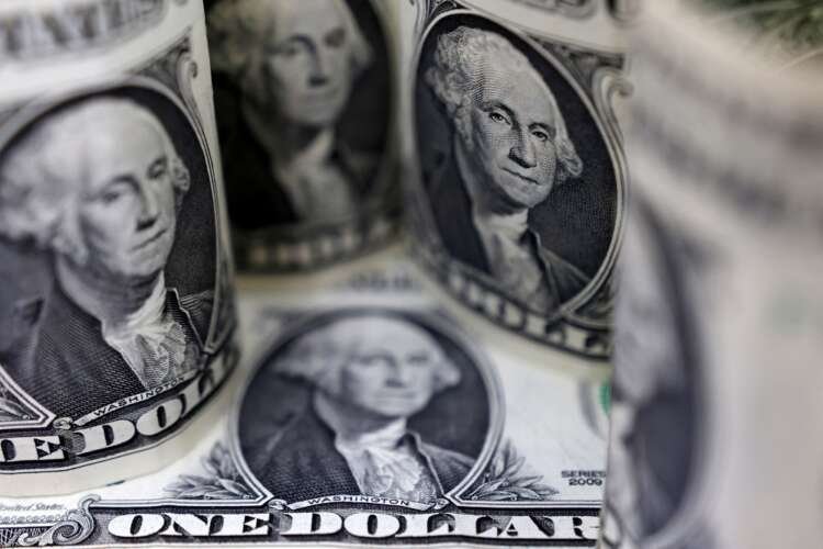 U.S. Dollar banknotes symbolizing currency fluctuations ahead of inflation report - Global Banking & Finance Review