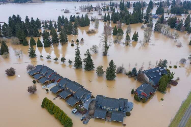 Flooded highway in Chehalis, Washington, illustrating water-related disasters - Global Banking & Finance Review