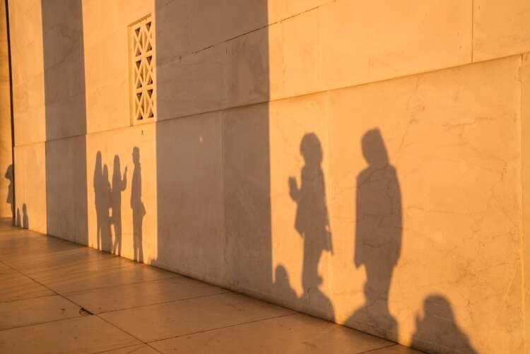 Graduates at Georgetown University graduation in front of Lincoln Memorial - Global Banking & Finance Review