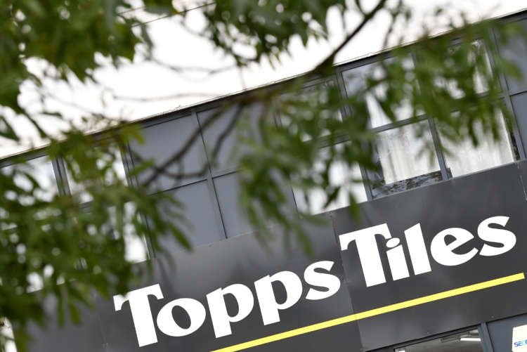 UK’s Topps Tiles expects sales, margin to recover after first-half hitSignage is seen outside a branch of Topps Tiles, London, Britain