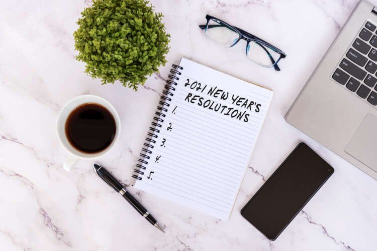 A notepad with New Year’s resolutions related to finance and automation - Global Banking & Finance Review