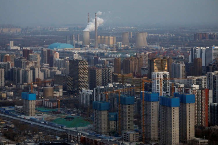 FILE PHOTO: Residential buildings under construction are seen near the central business district (CBD) in Beijing