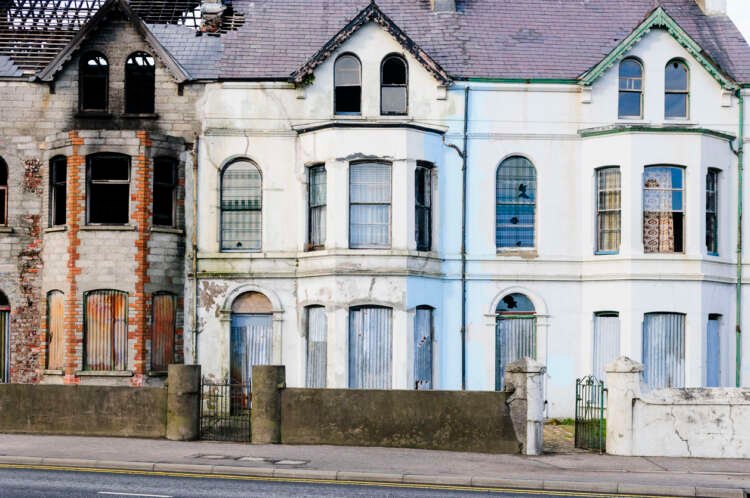 Burned out council homes in disrepair highlighting housing issues in the UK - Global Banking & Finance Review