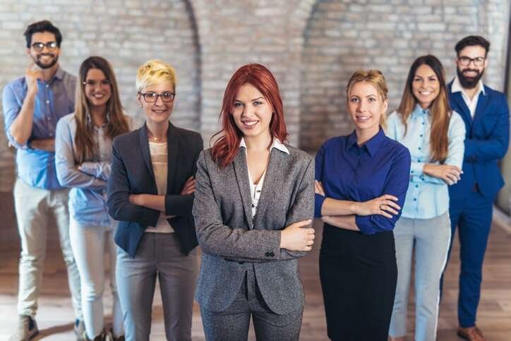 Business professionals collaborating on translation services for global ventures - Global Banking & Finance Review