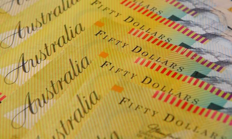 Australian dollar notes and coins reflecting commodity currency gains - Global Banking & Finance Review