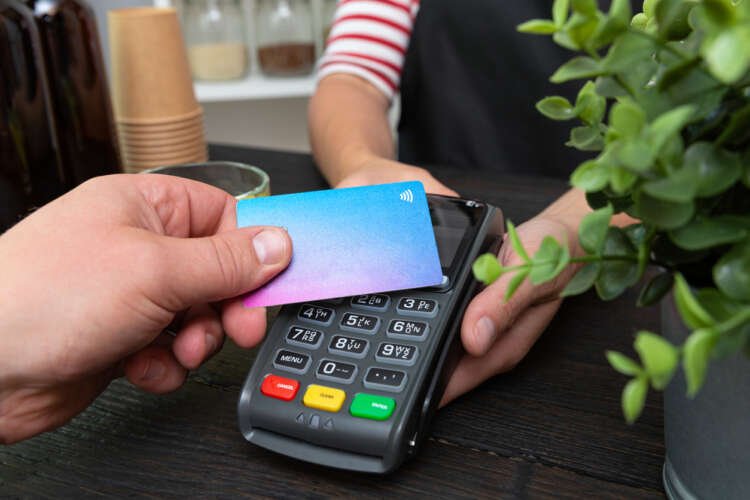 Customer using contactless payment technology for a purchase - Global Banking & Finance Review