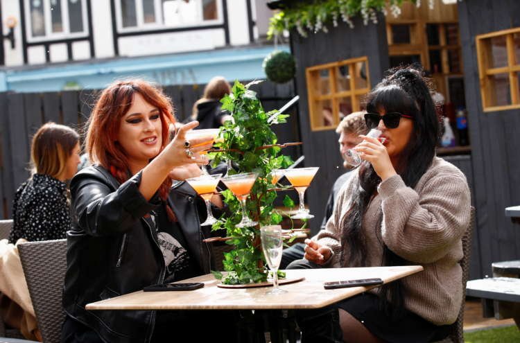 Image for Free at last to hug and party: UK reopens for business