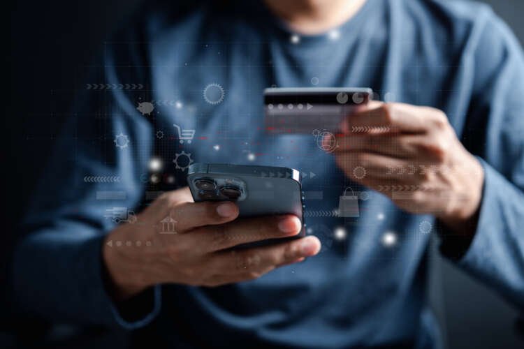 A person using a smartphone for banking, illustrating AI's impact on customer interactions - Global Banking & Finance Review
