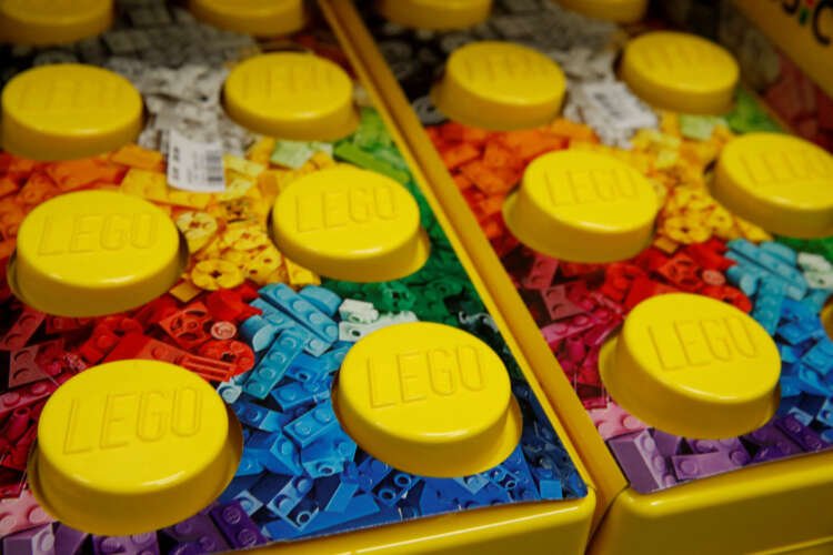 Lego bricks displayed in a store, highlighting the company's sustainable material challenges - Global Banking & Finance Review