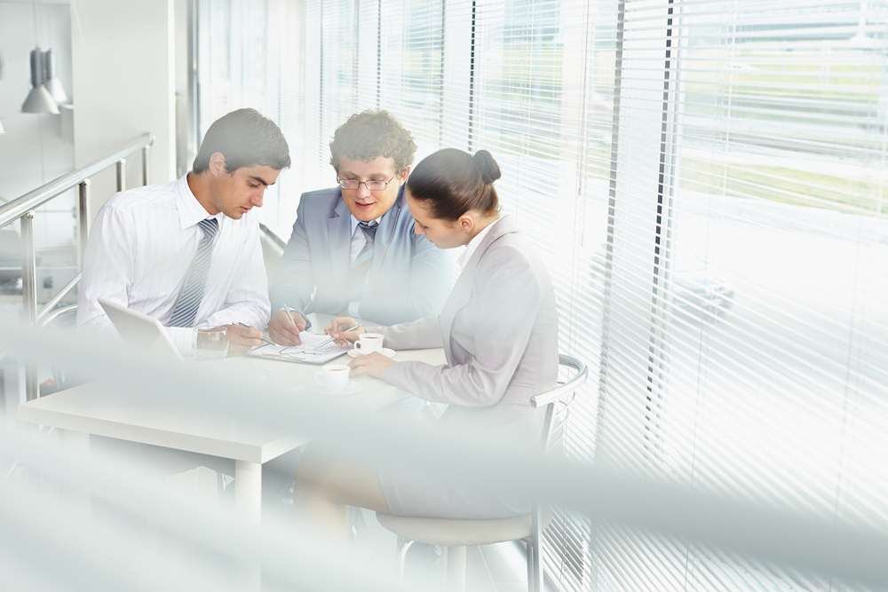 Team of tech professionals collaborating in an office, emphasizing talent in agility - Global Banking & Finance Review